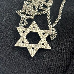 Star of David pendant with 16 inch chain with 2” extender. Clear crystals